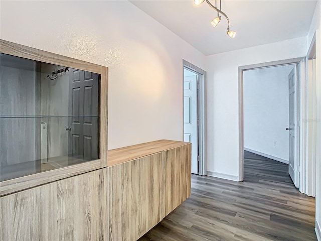 hall with dark hardwood / wood-style floors