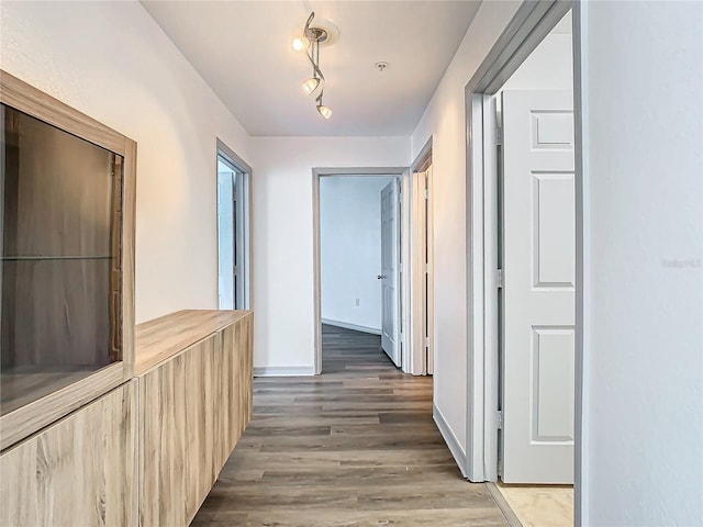 hall with dark wood-type flooring