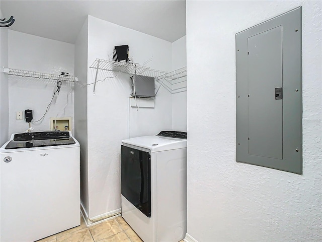 washroom with light tile patterned flooring, electric panel, and separate washer and dryer