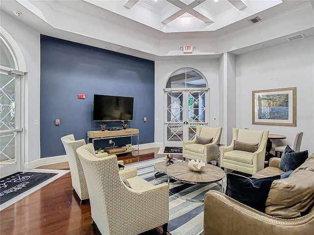 living room featuring coffered ceiling, french doors, a raised ceiling, and dark hardwood / wood-style floors