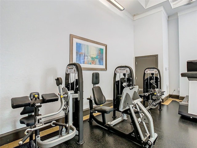 gym with ornamental molding