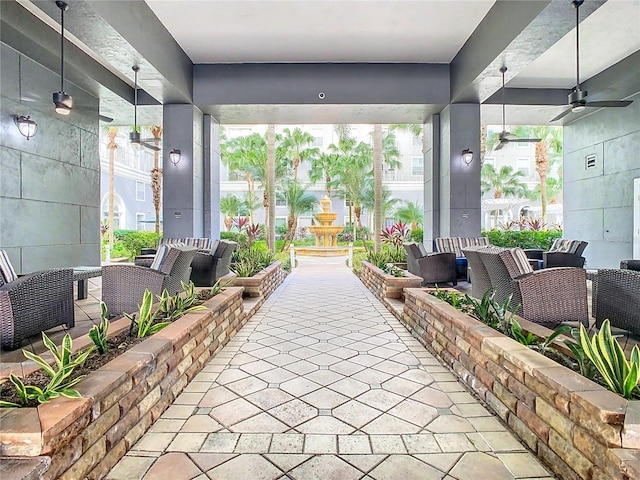 view of patio featuring ceiling fan