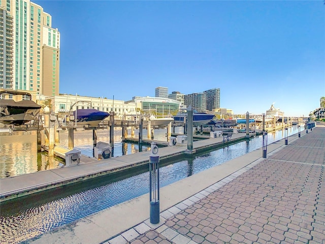 view of pool featuring a dock and a water view