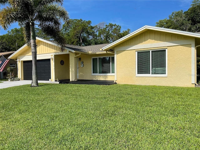 single story home with a front yard and a garage