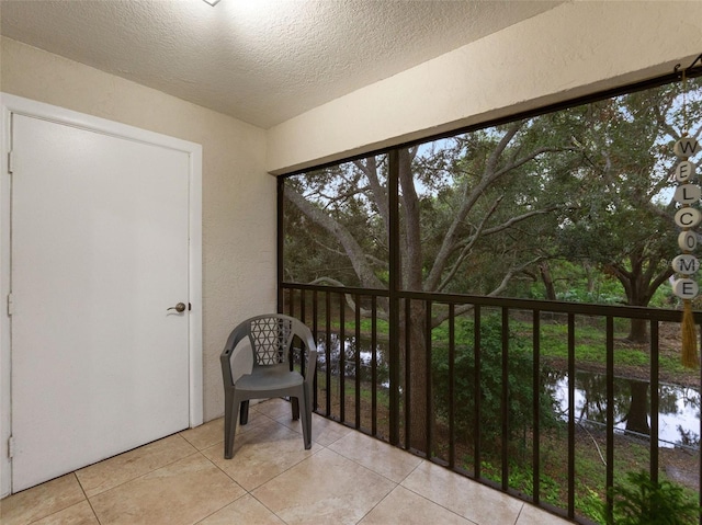 sunroom with a water view