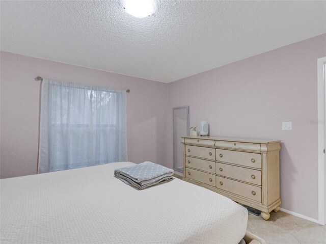 bedroom featuring a textured ceiling