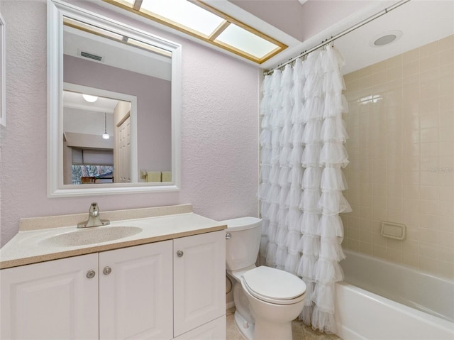 full bathroom featuring toilet, shower / tub combo, and vanity