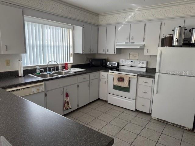 kitchen featuring light tile patterned flooring, sink, white cabinets, crown molding, and white appliances