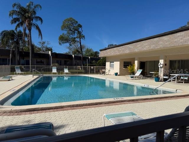 view of swimming pool with a patio