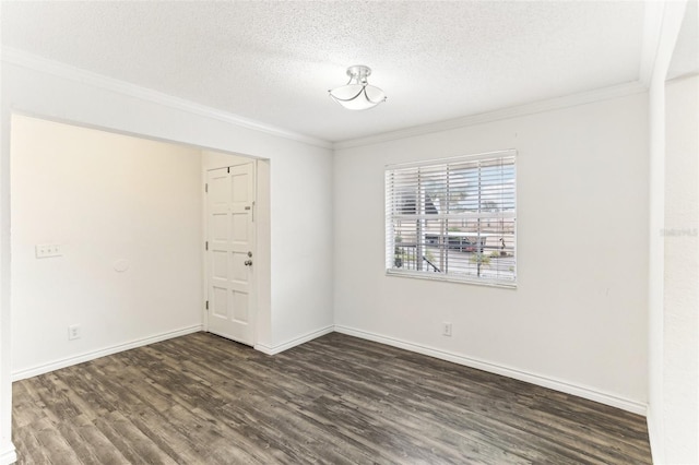 empty room with crown molding, dark hardwood / wood-style floors, and a textured ceiling