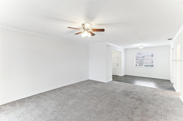 carpeted empty room with ornamental molding, ceiling fan, and a textured ceiling