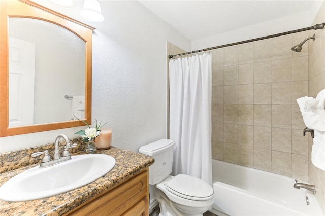 full bathroom with vanity, toilet, and shower / tub combo