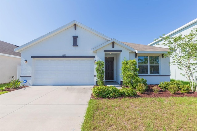 ranch-style house featuring a garage and a front lawn