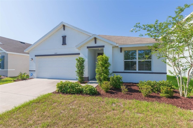 ranch-style home featuring a garage and a front lawn