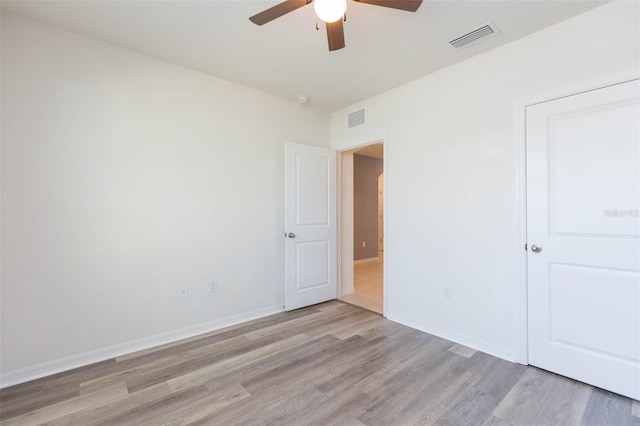 unfurnished bedroom featuring ceiling fan and light wood-type flooring