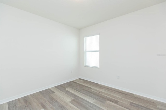 spare room featuring light hardwood / wood-style flooring