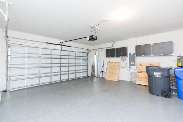 garage with electric panel and a garage door opener