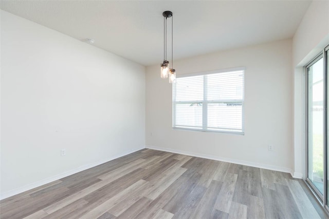 spare room with light wood-type flooring