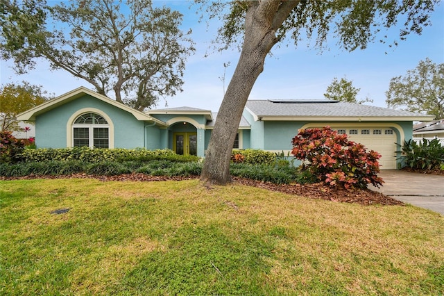 ranch-style house with a front lawn and a garage