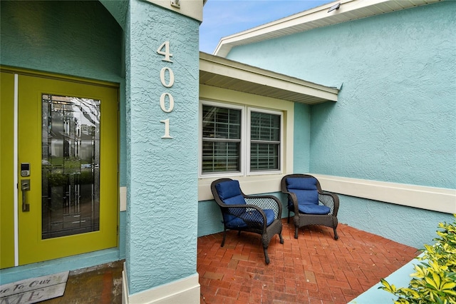 doorway to property featuring a patio area