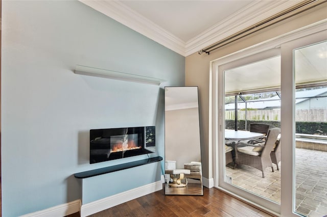 interior space with ornamental molding, a multi sided fireplace, and wood-type flooring