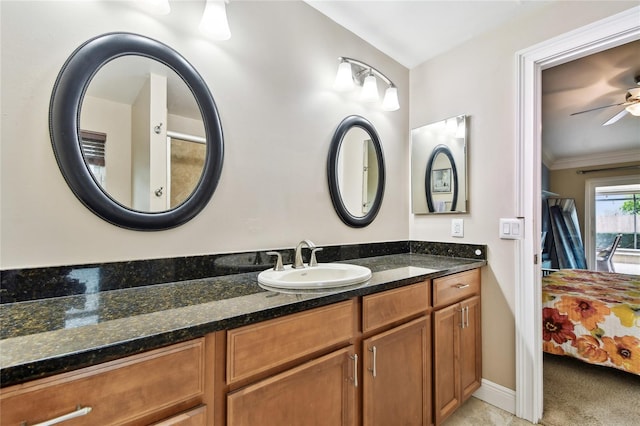 bathroom featuring ceiling fan, vanity, and crown molding