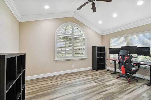 office space featuring crown molding, lofted ceiling, light hardwood / wood-style flooring, and ceiling fan