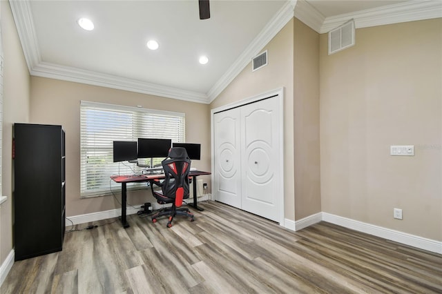 office featuring light hardwood / wood-style floors, crown molding, and lofted ceiling