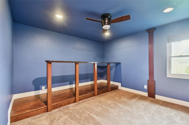 unfurnished bedroom featuring ceiling fan and carpet floors