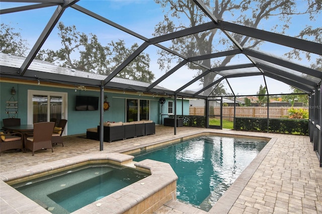 view of swimming pool with an in ground hot tub, a patio area, and outdoor lounge area