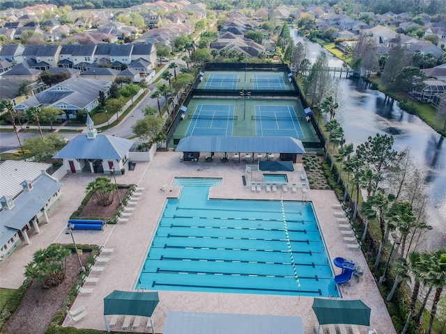 view of swimming pool with a patio and tennis court