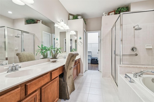 bathroom with plus walk in shower, tile patterned floors, and vanity