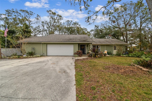 ranch-style home with a front yard and a garage