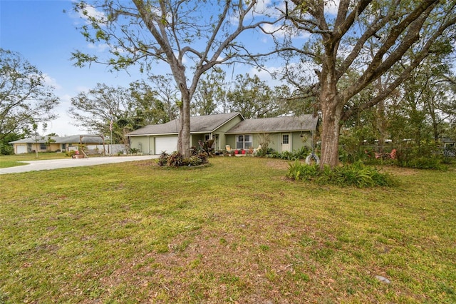 ranch-style home featuring a front lawn and a garage