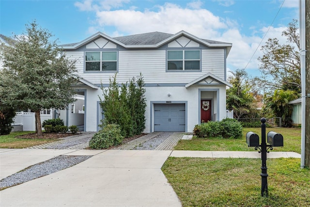 view of front of home featuring a front lawn and a garage