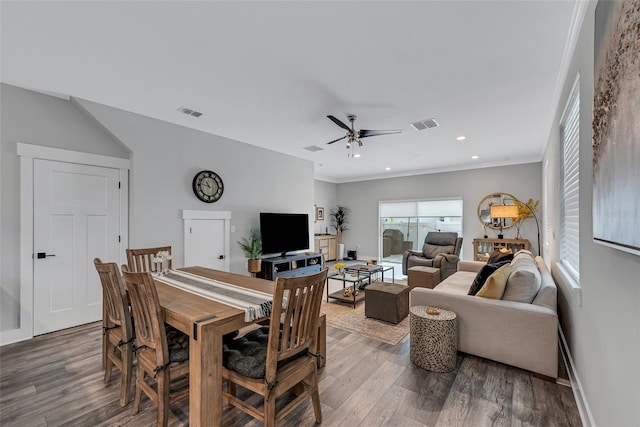 dining room featuring ceiling fan, a healthy amount of sunlight, crown molding, and hardwood / wood-style flooring