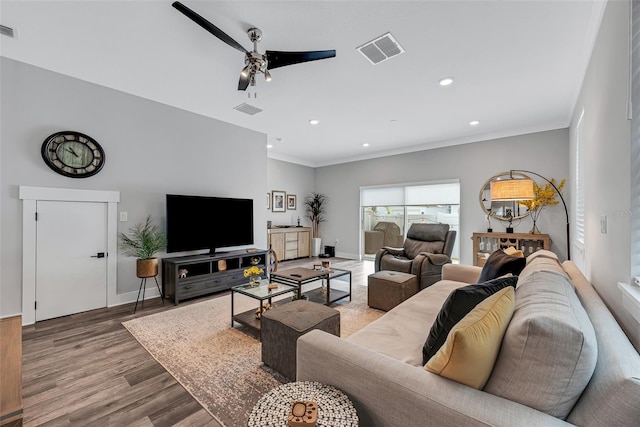 living room with hardwood / wood-style flooring and ceiling fan