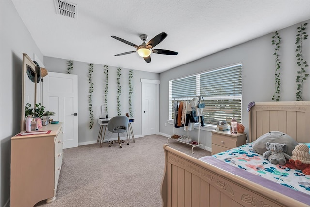 bedroom with ceiling fan and light colored carpet