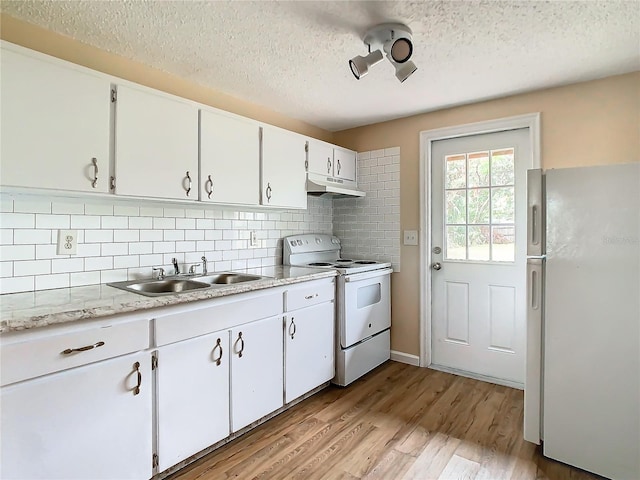 kitchen with white cabinetry, sink, white appliances, and backsplash