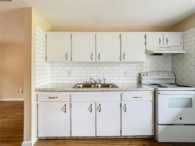 kitchen featuring a textured ceiling, white electric range, white cabinetry, decorative backsplash, and sink