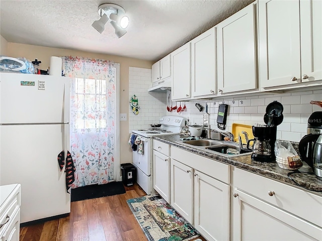 kitchen featuring sink, white appliances, dark hardwood / wood-style floors, and white cabinets