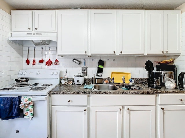 kitchen featuring backsplash, white cabinetry, and white electric stove