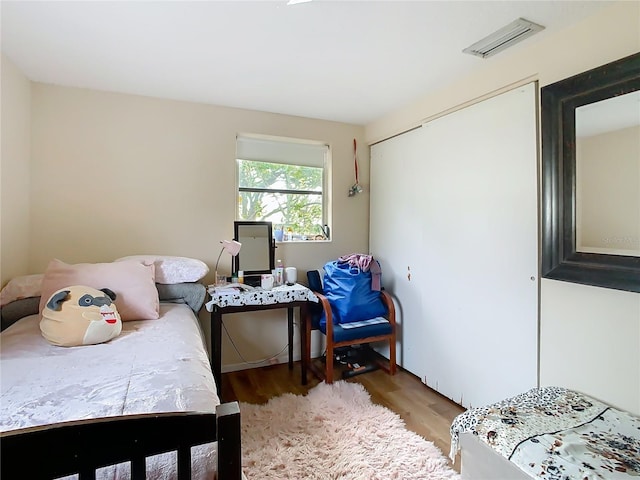 bedroom featuring hardwood / wood-style floors