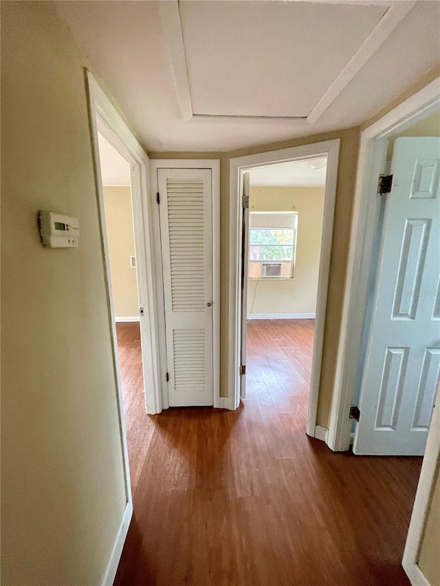 corridor featuring wood-type flooring