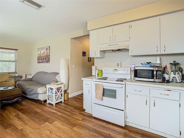 kitchen with white electric range oven, white cabinets, and light wood-type flooring