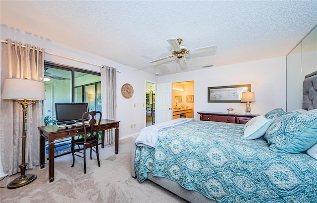 bedroom featuring light carpet, a textured ceiling, ceiling fan, and access to outside