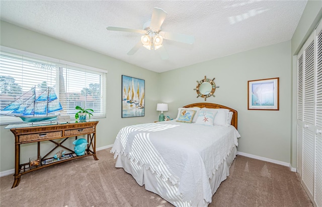 bedroom featuring carpet flooring, a closet, and ceiling fan