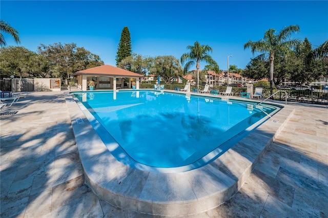 view of swimming pool with a patio area and a gazebo