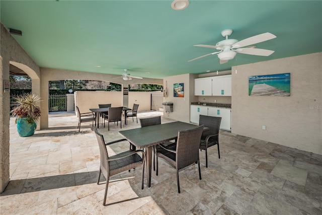 view of patio / terrace featuring ceiling fan