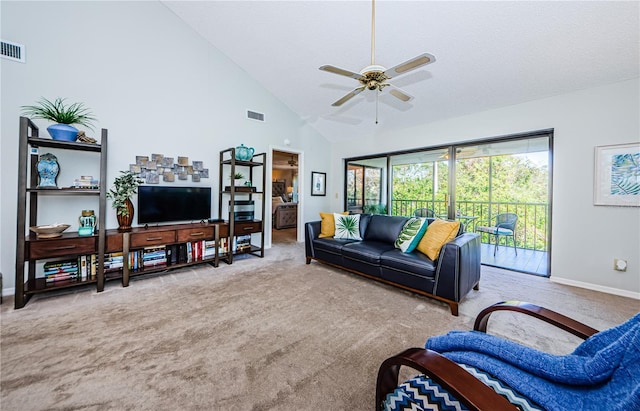 carpeted living room featuring ceiling fan and high vaulted ceiling